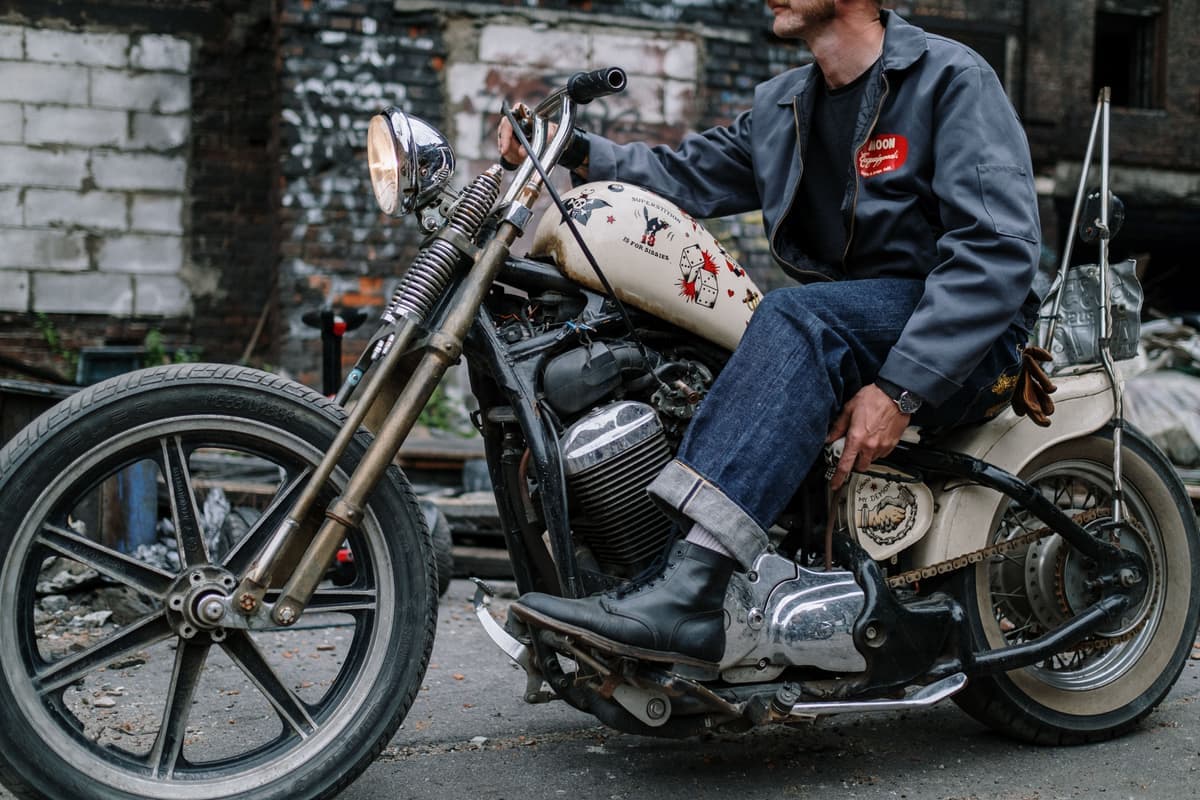 Motorcycle riding boots on the footpeg of a bike