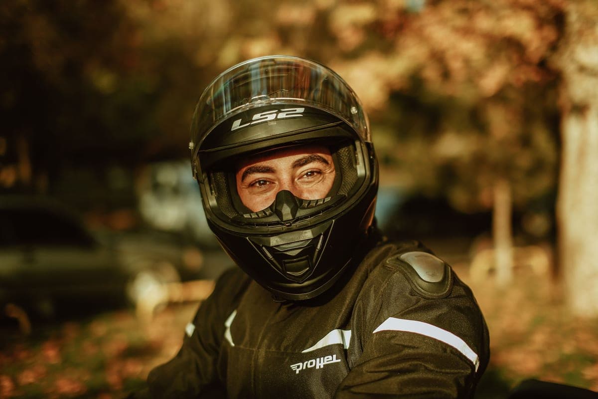 A rider wearing a helmet fitted with a communication headset